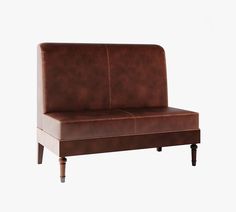 a brown leather couch sitting on top of a wooden frame