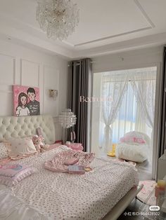 a white bed sitting in a bedroom next to a window covered in pink and white curtains