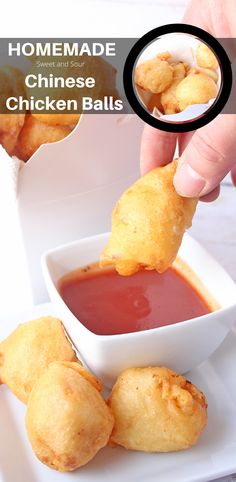 someone dipping sauce into some fried chicken balls in a white bowl on top of a plate