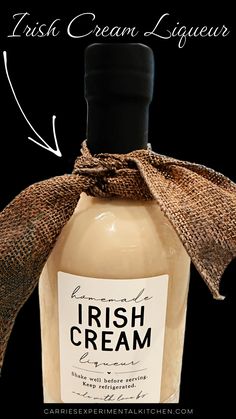 a bottle of irish cream liqueur on a black background with the label labeled