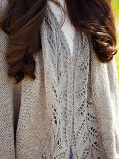 a close up of a woman wearing a sweater