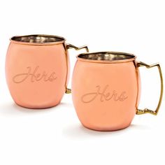 two copper mugs with the letter i on them