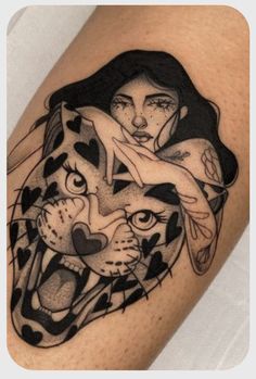 a woman and a tiger tattoo on the left upper half of her arm, which is black and white