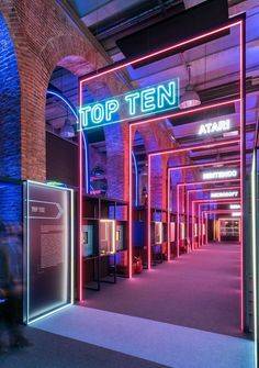 the inside of a building with neon lights