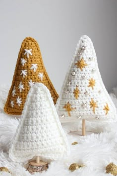 three crocheted christmas trees with gold stars on them and the text, beginner crochet christmas tree decor