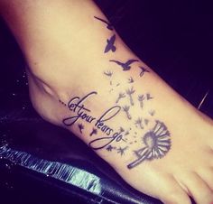 a dandelion tattoo on the foot with words