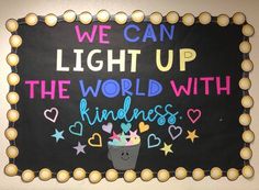 a sign that says, we can light up the world with kindness and stars on it