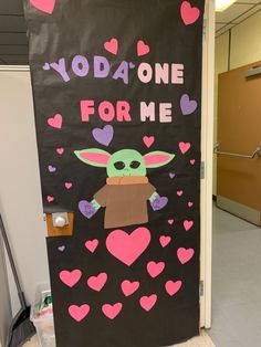 a door decorated with the baby yoda one for me sign and hearts on it