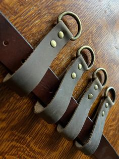 "Black OR Brown Leather Belt Loop Attachments - Antique Brass Hardware - Durable Belt Accessories - Work Suspenders  BELT LOOP ATTACHMENTS made for 2\" inches wide belts  Looking for handcrafted accessories for suspenders or tactical gear? You've found the right place! ✅ THIS SET COMES WITH 4 BELT LOOP ATTACHMENTS ✅ 100% REAL GENUINE LEATHER ✅ Heavy Duty Belt Loop - Solid build quality to last ✅ Lifetime warranty ✅ Hand Crafted in the USA ATTENTION: Will fit belts up to and including 2\"inches wide. *Black or Brown Leather  *Antique Brass  *Snap or Double Rivets Style *Handmade Accessory  *D Ring PLEASE keep in mind that custom orders/sizes CANNOT be returned. A restocking fee of 15% of the item's purchase price applies to ALL productions on this shop." Suspenders And Belt, Duty Belt, Wide Belts, Antique Brass Hardware, Handcrafted Accessories, Brown Leather Belt, Belt Accessories, Suspender Belt, Wide Belt