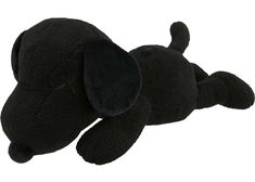 a black stuffed dog laying on its side