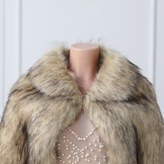 This elegant faux fur wrap is an exquisite winter wedding accessory. Expertly crafted with a lapel collar and butterfly sleeves, it's made from a luxurious khaki faux fur fabric. Perfect for adding a touch of sophistication to any ensemble. Winter Wedding Accessories, Faux Fur Wrap, Fur Wrap, Fur Fabric, Wedding Wraps, Wedding Accessory, Faux Fur Fabric, Fur Fabrics, Butterfly Sleeves