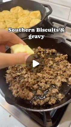 someone is cooking food in a skillet on the stove with words southern biscuits and gravy