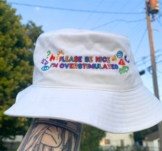 Express yourself with the vibrant and nostalgic "Please Be Nice I'm Overstimulated" kidcore bucket hat! Featuring a rainbow aesthetic embroidered design, this hat is a fun statement piece. Perfect for those who love bold colors and want to showcase their unique personality. Embrace your individuality and make a fashion statement with this eye-catching accessory! ✰ ABOUT OUR PRODUCTS✰ Our products are comfy and made to order with unique and trendy designs. ✰ S H I P P I N G & P R O C E S S I N G Bucket Hat Ideas, Funny Bucket Hats, Bucket Hat Aesthetic, Y2k Hats, Kidcore Clothing, Cute Bucket Hat, Hat Y2k, Hat Aesthetic, Bucket Hat Women