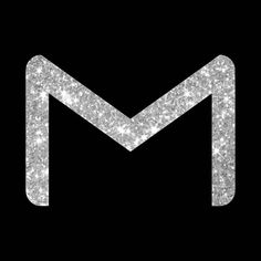 the letter m is made up of silver sparkles on a black background with white stars