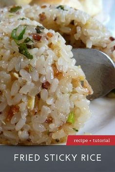 a white plate topped with rice and a fork