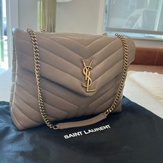 Brand New Ysl Saint Laurent Shoulder Bag In Overstitched Y-Quilted Leather - Sleek, Leather Bag Perfect For Everyday Chain And Leather Shoulder Straps; 19.29" Drop Unfolded, 9.84" Drop Folded Can Be Worn Doubled On The Shoulder Envelope Flap With Ysl Logo; Snap Closure Bronze Metal Hardware Zip Pocket Divides Interior; One Zip And One Slip Pocket Fabric Lining 8.6"H X 12"W X 4.7"D Approx. Weight 2.1 Lb. Made In Italy Designer Taupe Shoulder Bag For Formal Occasions, Luxury Taupe Shoulder Bag For Evening, Designer Taupe Evening Bags, Luxury Taupe Evening Bag, Ysl Loulou Bag Outfit, Lux Purse, Ysl Loulou Bag, Ysl Lou Camera Bag, Taupe Outfit