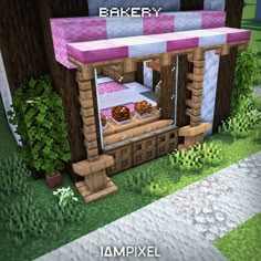 a small pink and white building with some food on the top shelf in front of it