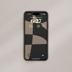 an iphone with the time displayed on its screen is shown in front of a white background