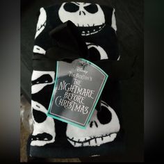 there is a black and white scarf with a tag on it that says the nightmare before christmas