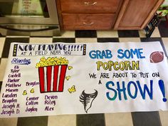 a sign that says grab some popcorn we are about to put on show