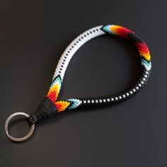 a multicolored lanyard with a metal hook