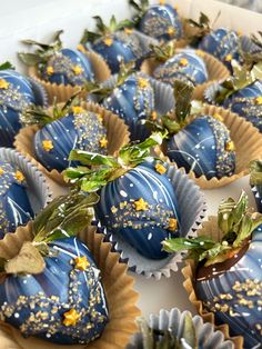 blue chocolate covered strawberries with gold sprinkles