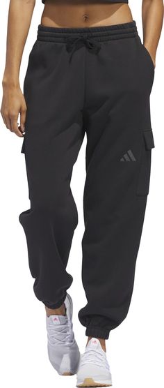 These cozy adidas sweatpants are made for living life on your own terms. The loose fit and soft-touch fleece means maximum comfort whether you're curled up for movie night or running weekend errands. Roomy cargo pockets give you extra space to stash your phone, keys or whatever else you need quick access to. Wherever your day takes you, these pants will keep you feeling casual and carefree. Fit & Design: Loose fit Drawcord on elastic waist Side pockets Cargo pockets Elastic cuffs Womens Athletic Outfits, Adidas Sweatpants, Cargo Joggers, Athletic Apparel, Athletic Outfits, Living Life, Movie Night, Adidas Women, Fun Sports