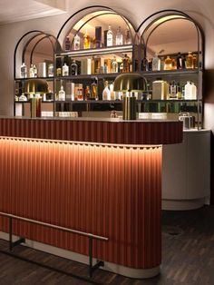 an empty bar with bottles on the shelves