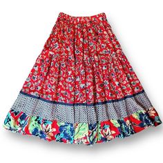 Vintage 90's Lucia Lukken Broomskirts Floral Midi Skirt Women's Size Petite Small Gently worn with no stains or flaws Red colorful floral tiered rayon skirt Contrasting floral paneled flounce hem with blue denim trim Elastic waist Aesthetic: Boho - Western - Cottagecore - Southwestern - Shabby Chic 100% Rayon Made in the USA Waist 26" unstretched Length 32" Red Tiered Skirt With Relaxed Fit, Red Flowy Maxi Skirt For Festival, Red Cotton Midi Skirt, Red Tiered Maxi Skirt For Festival, Bohemian Red Flared Skirt Bottoms, Red Bohemian Skirt For Spring, Red Bohemian Relaxed Skirt, Red Tiered Gathered Skirt, Spring Festival Red Maxi Skirt