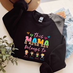 "This Mama Belongs To Children Sweatshirt, Personalized Mom Sweatshirt, Gift for Mothers Day, Mama Children Name Sweat,Custom Mama Sweatshirt Welcome to the different, crazy and colorful world of ORANGE WORLD :) PRODUCT DETAILS Collar, shoulders, armholes, cuffs and hem double-needle stitched  -  1 x 1 rib with spandex Features a crewneck -  Relaxed fit - Unisex -  50% cotton 50% polyester HOW TO ORDER 1- Please review all photos, 2- Choose your size and color from the drop-down menus, 3- Click Mother's Day Black Crew Neck Sweatshirt, Mother's Day Black Graphic Print Sweatshirt, Black Graphic Print Mother's Day Sweatshirt, Black Graphic Print Sweatshirt For Mother's Day, Gift For Mothers Day, Colorful World, Mama Sweatshirt, Mom Sweatshirt, Kid Names