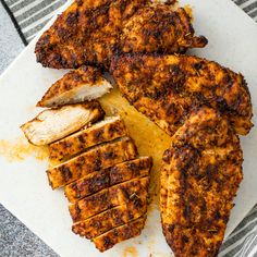 some chicken is cut up and sitting on a cutting board