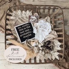 a basket filled with baby items on top of a white wooden floor next to a sign that says, no really this is the place probably maybe