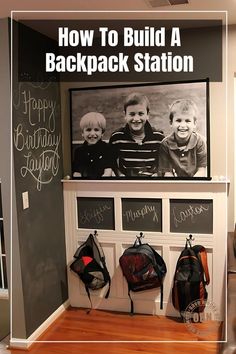 an entry way with chalkboard and backpacks hanging on the wall, along with two children's backpacks