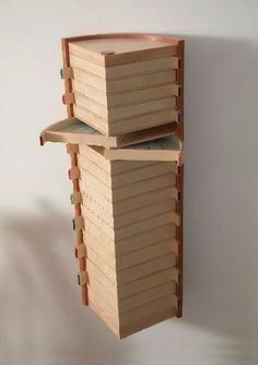 two wooden boxes are stacked on top of each other in the shape of a beehive