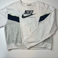 Super Cozy Crewneck By Nike! Heather Gray Sweatshirt With Navy Colorblock Details. Yellow Stitching Details. Black Signature Decal. Multiple Sizes. Oversized Fit. Nwt! Authentic I Am A Posh Ambassador, So Purchase With Confidence No Tradesno Pplno Low Balls Gray Crew Neck Tops For Athleisure, Sporty Gray Crew Top, Sporty Gray Color Block Tops, Nike Gray Sportswear Top, Gray Color Block Crew Neck Sweatshirt, Gray Color Block Crew Neck Top, Nike Gray Tops For Fall, Nike Gray Sporty Top, Vintage Nike Sweatshirt