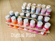 there are many different colors of paint on the table and one is labeled digital files