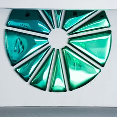 a circular design made out of green glass