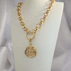 PRODUCT DESCRIPTION With this necklace, you can't be missed!  This gold chunky medallion statement necklace features a large gold-edged, gold coin medallion on an extra chunky, cable chain. MEASUREMENT AND SIZE (on model) The total length of the necklace is 16 inches (40cm). Choose your necklace length from the drop-down menu. Pendant size 0.8 inches *0.8 inches (2cm) MATERIAL Micron Gold plated chain - Thick durable plating, safe to use in regular water. GIFT WRAPPED: Every order is beautifully Water Gift, Gold Coin Necklace, Greek Coins, Necklace Chunky, Gold Coin, Coin Necklace, Design Jewelry, Chain Choker, Gold Coins