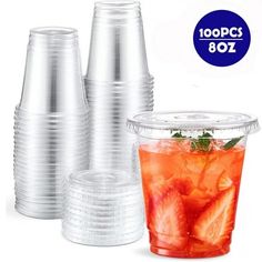 plastic cups with strawberries in them on a white background