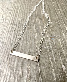 Simple and elegant sterling silver bar necklace on 2.8mm round rolo chain, also sterling silver with lobster closure.  14/20 Gold-Filled bar pendants are also available, as well as in different sizes. Please refer to my other listings for details and pricing.  Measurements: This bar is approx 1.25" x .25" x 1.5mm on 2.8mm rolo chain 16" I would love to work with you to personalize your own design, so please feel free to message me to discuss your ideas and options. Silver Bar Necklace Perfect As A Gift, Elegant Silver Rectangular Bar Necklace, Sterling Silver Bar Necklace With Adjustable Chain As Gift, Silver Bar Necklace With Adjustable Chain As Gift, Silver Dainty Bar Necklace For Everyday, Classic Silver Bar Necklace For Anniversary, Minimalist Sterling Silver Bar Necklace For Anniversary, Classic Silver Bar Necklace As A Gift, Dainty Silver Bar Necklace Gift