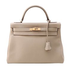 Hermes Model, Togo Leather, Rain Cover, Leather Handbag, Bottega Veneta, Gold Hardware, Leather Handbags, Timeless Design