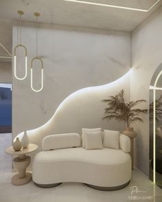 a modern living room with white furniture and lighting