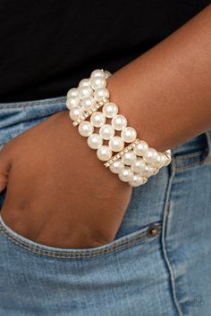 Held together by white rhinestone dotted gold fittings, row after row of bubbly white pearls are threaded along stretchy bands around the wrist for a timeless elegance. Live Text, Gold Pearl Bracelet, Paparazzi Accessories, White Rhinestone, Paparazzi Jewelry, Gold Pearl, Accessories Bracelets, Pearl Bracelet, Pearl White