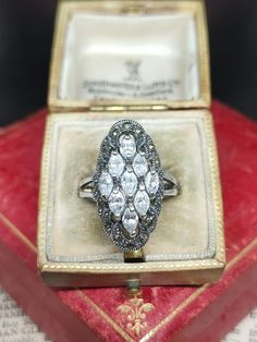 Here we have a stunning statement ring inspired by the art deco era set with sparkling marquise cut cubic zirconia with marcasite halo in sterling silver marked 925 UK size - P1/2 US size - 8 Message me any questions  ITEM - S2167 Art Deco Era, Art Deco Inspired, Marquise Cut, Statement Ring, Rings Statement, Statement Rings, Halo, Cubic Zirconia, Jewelry Rings