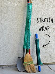 two brooms are leaning against a wall with the words stretch wrap written on it