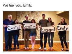 four people holding up signs that say we feel you, emily except expecting engaged