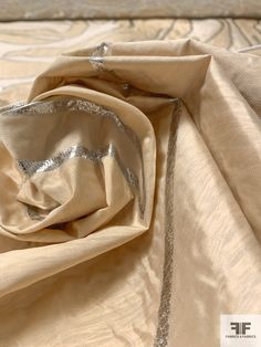 SKU: 16626 Content: Polyester / Lurex Color: Biscotti / Silver Width: 58 inches Origin: Italy Cream Silk Fabric For Wedding, Festive Cream Elegant Fabric, Elegant Silk Fabric For Festive Occasions, Elegant Silk Fabric In Traditional Drape, Elegant Silk Fabric Traditional Drape, Formal Beige Silk Dupatta, Beige Silk Dupatta, Elegant Raw Silk Dupatta Fabric, Fabric Gifts