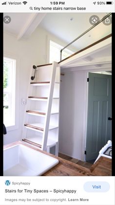 a kitchen with a sink and ladder in it