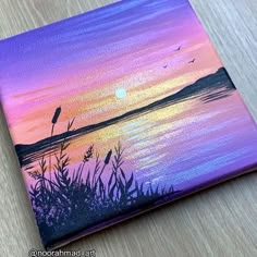 an acrylic painting of a sunset over a lake