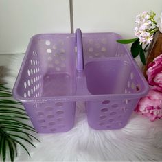 two purple plastic baskets sitting next to each other on a white furnishing floor